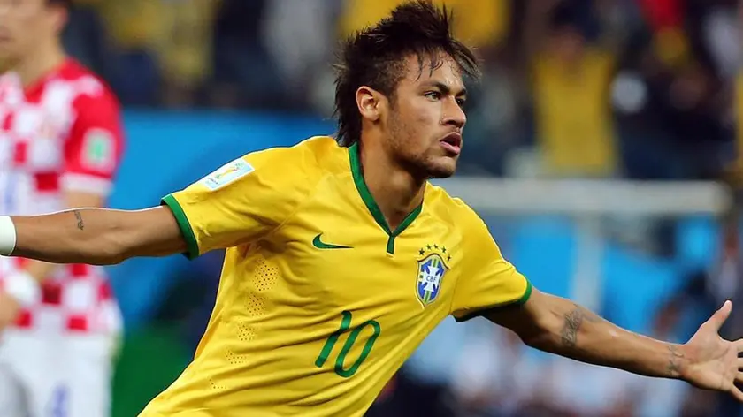 Neymar of Brazil celebrates after scoring the 1-1 during the FIFA World Cup 2014 group A preliminary round match between Brazil and Croatia at the Arena Corinthians in Sao Paulo, Brazil, 12 June 2014. (RESTRICTIONS APPLY: Editorial Use Only, not used in association with any commercial entity - Images must not be used in any form of alert service or push service of any kind including via mobile alert services, downloads to mobile devices or MMS messaging - Images must appear as still images and must not emulate match action video footage - No alteration is made to, and no text or image is superimposed over, any published image which: (a) intentionally obscures or removes a sponsor identification image; or (b) adds or overlays the commercial identification of any third party which is not officially associated with the FIFA World Cup). ANSA/DIEGO AZUBEL +++EDITORIAL USE ONLY+++