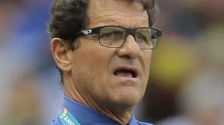 Russia's head coach Fabio Capello, left, and Belgium's head coach Marc Wilmots, right, stand on the touchline during the group H World Cup soccer match between Belgium and Russia at the Maracana stadium in Rio de Janeiro, Brazil, Sunday, June 22, 2014. (AP Photo/Ivan Sekretarev)