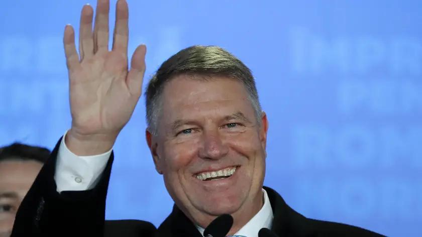 epa08022895 Romanian acting President Klaus Iohannis smiles while addressing to media after first exit-polls results were announced, at the PNL headquarters, during the presidential elections runoff in Bucharest, Romania, 24 November 2019. According to exit polls, Romania's centre-right acting president Klaus Iohannis won presidential elections in Romania. EPA/ROBERT GHEMENT