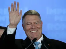 epa08022895 Romanian acting President Klaus Iohannis smiles while addressing to media after first exit-polls results were announced, at the PNL headquarters, during the presidential elections runoff in Bucharest, Romania, 24 November 2019. According to exit polls, Romania's centre-right acting president Klaus Iohannis won presidential elections in Romania. EPA/ROBERT GHEMENT