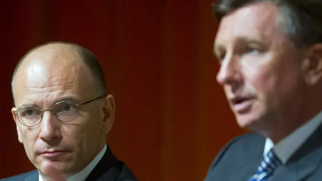 Italy's prime minister Enrico Letta, left, listens to the speech of Slovenia's president Borut Pahor, right, during panel discussion at Bled Strategic Forum meeting in Bled, Slovenia, Monday, Sept. 2, 2013. (AP Photo/Darko Bandic)