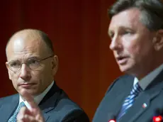 Italy's prime minister Enrico Letta, left, listens to the speech of Slovenia's president Borut Pahor, right, during panel discussion at Bled Strategic Forum meeting in Bled, Slovenia, Monday, Sept. 2, 2013. (AP Photo/Darko Bandic)