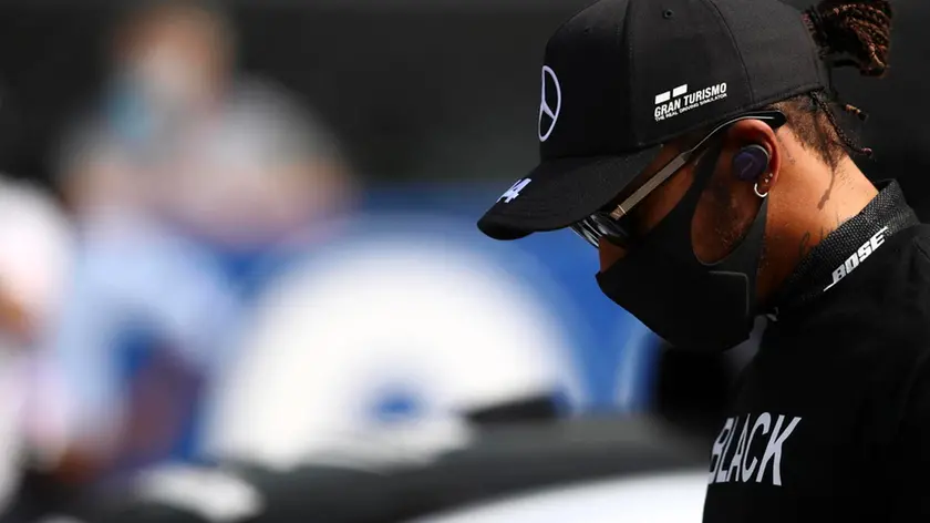 epa08650485 British Formula One driver Lewis Hamilton of Mercedes-AMG Petronas wears a shirt featuring 'black lives matter' on the grid prior to the 2020 Formula One Grand Prix of Italy at the Monza race track, Monza, Italy 06 September 2020. EPA/Mark Thompson / Pool