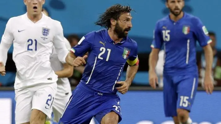 epa04257879 Italy's Andrea Pirlo (C) controls the ball next to England's Ross Barkley during the FIFA World Cup 2014 group D preliminary round match between England and Italy at the Arena Amazonia in Manaus, Brazil, 14 June 2014. (RESTRICTIONS APPLY: Editorial Use Only, not used in association with any commercial entity - Images must not be used in any form of alert service or push service of any kind including via mobile alert services, downloads to mobile devices or MMS messaging - Images must appear as still images and must not emulate match action video footage - No alteration is made to, and no text or image is superimposed over, any published image which: (a) intentionally obscures or removes a sponsor identification image; or (b) adds or overlays the commercial identification of any third party which is not officially associated with the FIFA World Cup) EPA/MAST IRHAM EDITORIAL USE ONLY