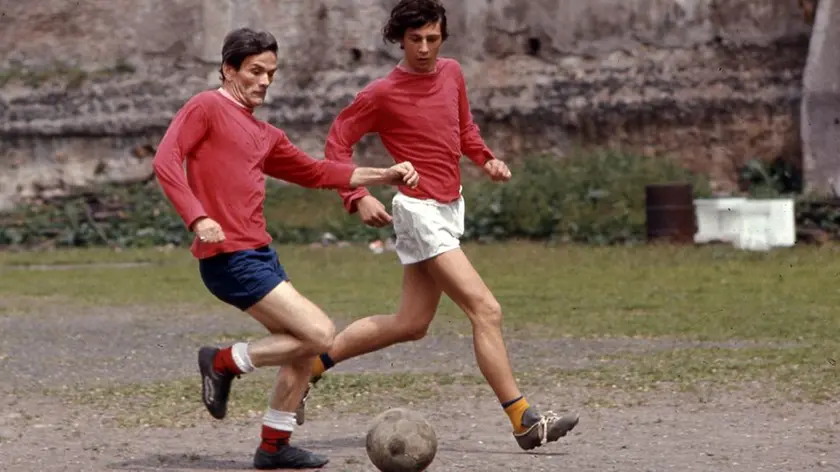 Rome, Italy --- Rome, Italy. Italian writer and movie director Pier Paolo Pasolini plays soccer with friends on the outskirts of Rome, Italy, April 8, 1971. (Photo by Vittoriano Rastelli) --- Image by © Vittoriano Rastelli/Corbis