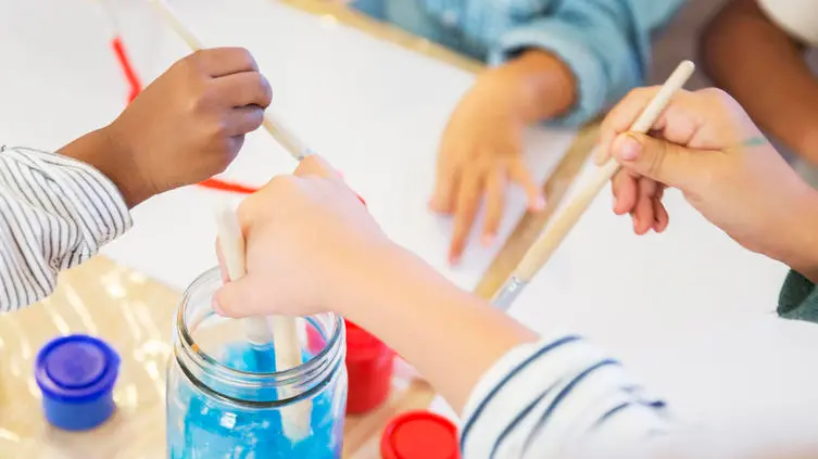 Students painting in class