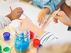 Students painting in class