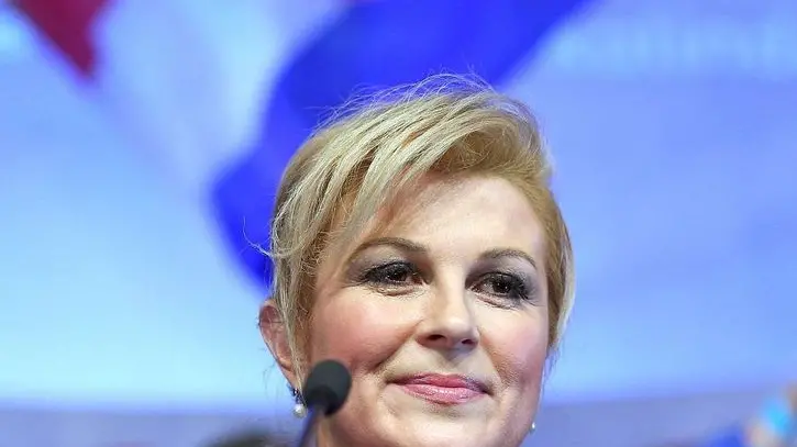 epa04541816 Presidential candidate of Croatian Democratic Union (HDZ) Kolinda Grabar-Kitarovic gives her speech after first results of Presidential elections in Zagreb, Croatia, 28 December 2014. Kitarovic will face current President Ivo Josipovic on the second round of the Presidential elections scheduled for 11 January 2015. EPA/STR