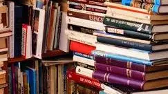 Bookshop with piled books in Seville, Spain. --- Image by © Mark Bolton/Corbis