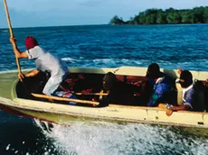 ca. 1990s, Indonesia --- In Batam, Indonesia pirates operate out of Riau Islands. Piracy is a big problem in the South China Sea and has been furthered by corrupt officials. Pirates practice boarding ships with bamboo rod with hook. | Location: Riau Island, Indonesia. --- Image by © Michael S. Yamashita/CORBIS