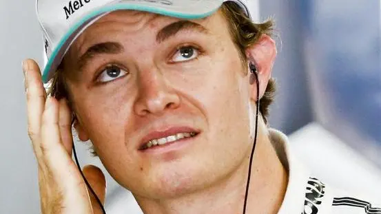 German Formula One driver Nico Rosberg of Mercedes AMG GP adjusts his ear piece during the first practice session ahead of the Japanese Formula One Grand Prix at the Suzuka Circuit in Suzuka, Japan, 11 October 2013. The race will be held on 13 October 2013. ANSA/DIEGO AZUBEL