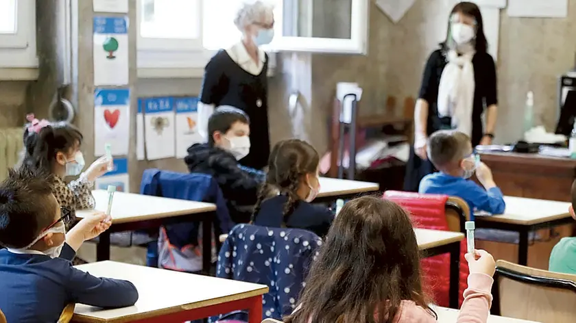 The pupils of the primary school of Travagliato, near Brescia, Italy, undergo salivary swabs, 14 May 2021. These salivary swab tests are like a lollipop candy to hold in the mouth for a minute, and the exam is done. This is the new salivary test to identify the infection from Covid 19. ANSA/ FILIPPO VENEZIA