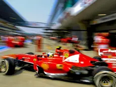 epa03659303 Brazilian Formula One driver Felipe Massa of Scuderia Ferrari drives out of the team garage during the first practice session at the Shanghai International circuit in Shanghai, China, 12 April 2013. The 2013 Chinese Formula One Grand Prix will take place on 14 April. EPA/DIEGO AZUBEL