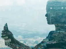 02 Jul 2013, Seoul, South Korea --- Girl using smartphone and city, double exposure. --- Image by © Jasper James/Corbis