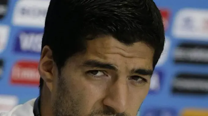 epa04275228 Uruguayan soccer player Luis Suarez during a press conference at Estadio das Dunas in Natal, Brazil, 23 June 2014. Uruguay will face Italy in their last preliminary match of group D for the FIFA World Cup Brazil 2014 on 24 June. (RESTRICTIONS APPLY: Editorial Use Only, not used in association with any commercial entity - Images must not be used in any form of alert or push service in any kind including via mobile alert services, downloads to mobile devices or MMS messaging - Images must appear as still images and must not emulate match action video footage - No alteration is made to, and no text or image is superimposed over, any published image which: (a) intentionally obscures or removes a sponsor identification image; or (b) adds or overlays the commercial identification of any third party which is not officially associated with the FIFA World Cup) EPA/Lavandeira jr EDITORIAL USE ONLY