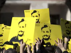 People hold signs depicting Giulio Regeni and reading ''365 days without Giulio'' as they attend a march in memory of the Italian researcher at Sapienza University on the first anniversary of his disappearance in Egypt, Rome, Italy, 25 January 2017. Italian President Sergio Mattarella on the same day called for cooperation to bring the killers of Regeni in Egypt to justice. 'Italy has mourned the killing of one of its studious young people, Giulio Regeni, without full light being shed on this tragic case for a year, despite the intense efforts of our judiciary and our diplomacy', Mattarella said on the first anniversary of Regeni's disappearance. 'We call for broader and more effective cooperation so that the culprits are brought to justice'. Guilio Regeni was an Italian PhD student researching the independent trade unions in Egypt, he disappeared on 25 January 2016 in Cairo, then his body was found in a ditch on Cairo-Alexandria road outside of Cairo on 03 February 2016 with signs of torture. ANSA/MASSIMO PERCOSSI