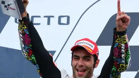 epa04905414 Second placed Italian Danilo Petrucci of Pramag Racing celebrates on the podium after the MotoGP race of the British Motorcycling Grand Prix at Silverstone race track, Northamptonshire, Britain, 30 August 2015. EPA/TIM KEETON