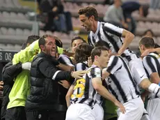 Fc Juventus' players celebrates after Mirko Vucinic scored the 1-0 against Cagliari Calcio during their Italian Serie A soccer match at 'Nereo Rocco' Stadium in Trieste, 6 May 2012. ANSA/ANDREA LASORTE