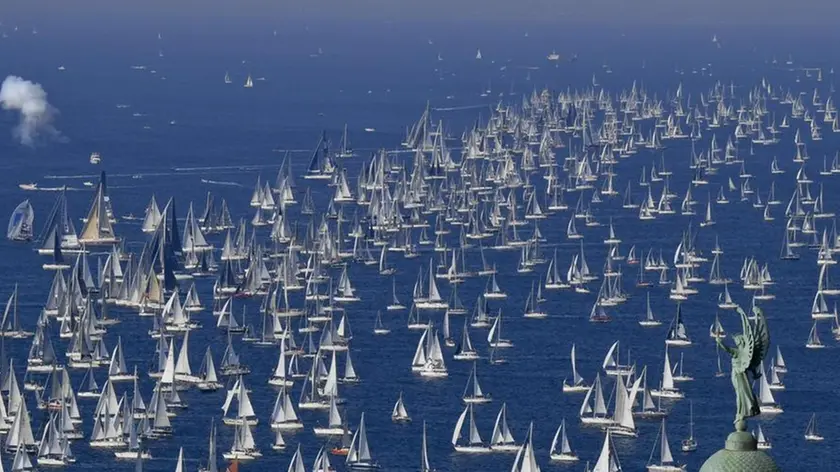 The 'Victory Lighthouse' overlooks hundreds of sailing boats as they crowd the Gulf of Trieste at the start of the 50th edition of the traditional 'Autumn Cup - Barcolana' regatta in Trieste, Italy, 14 October 2018. ANSA / CIRO FUSCO