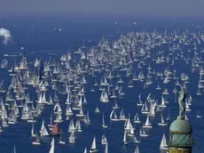 The 'Victory Lighthouse' overlooks hundreds of sailing boats as they crowd the Gulf of Trieste at the start of the 50th edition of the traditional 'Autumn Cup - Barcolana' regatta in Trieste, Italy, 14 October 2018. ANSA / CIRO FUSCO