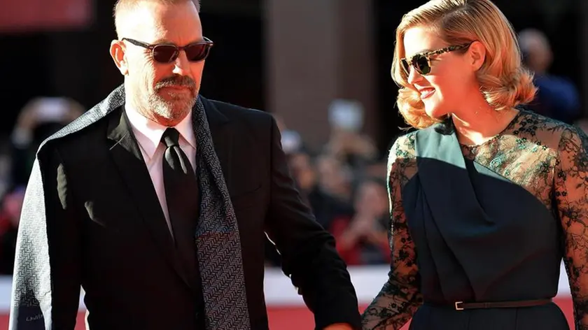 US actor Kevin Costner (L) and his daugther Lily, arrive for the premiere of 'Black and White', at the 9th annual Rome Film Festival, in Rome, Italy, 24 October 2014. The festival runs from 16 to 25 October. ANSA/CLAUDIO ONORATI
