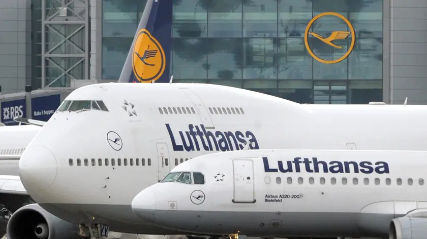 (FILE) A file photo dated 23 March 2009 showing passenger planes of German carrier Lufthansa waiting for take-off clearance at the airport in Frankfurt Main, Germany. EPA/BORIS ROESSLER