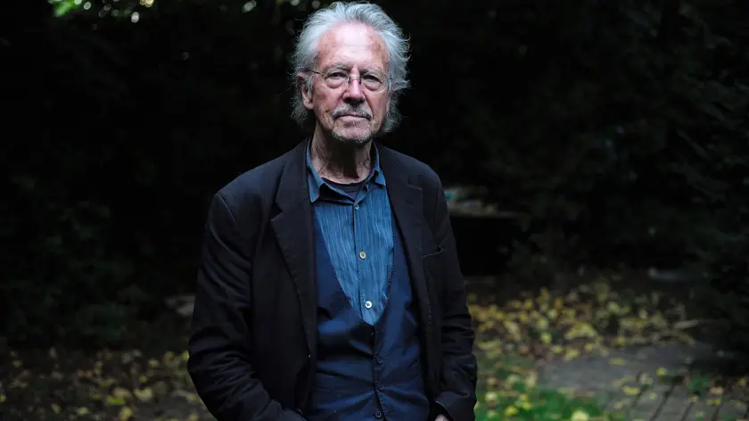 epa07910653 Austrian writer Peter Handke poses for photographs at his home in Chaville, near Paris, France, 10 October 2019. The Nobel Prize in Literature for 2019 is awarded to Peter Handke, the Swedish Academy announced on 10 October 2019. EPA/JULIEN DE ROSA