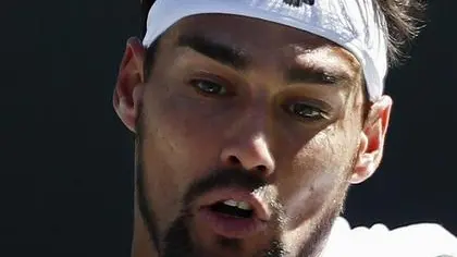 epa05843273 Fabio Fognini of Italy returns a shot against Jo-Wilfried Tsonga of France during their match at the 2017 BNP Paribas Open tennis tournament at the Indian Wells Tennis Garden in Indian Wells, California, USA 11 March 2017. EPA/LARRY W. SMITH