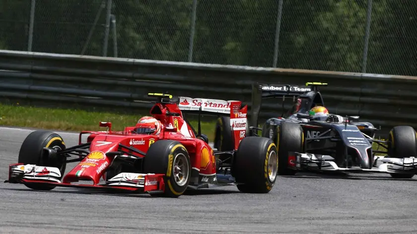 © Photo4 / LaPresse.22/06/2014 Spielberg, Austria.Sport .Grand Prix Formula One Austria 2014.In the pic: Kimi Raikkonen (FIN) Scuderia Ferrari F14-T and end Esteban Gutierrez (MEX), Sauber F1 Team C33 .