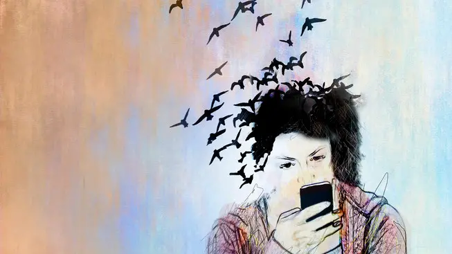 Conceptual illustration of a young woman on a smartphone her hair is turning into birds and flying away depicting loss of connection with the real wor...