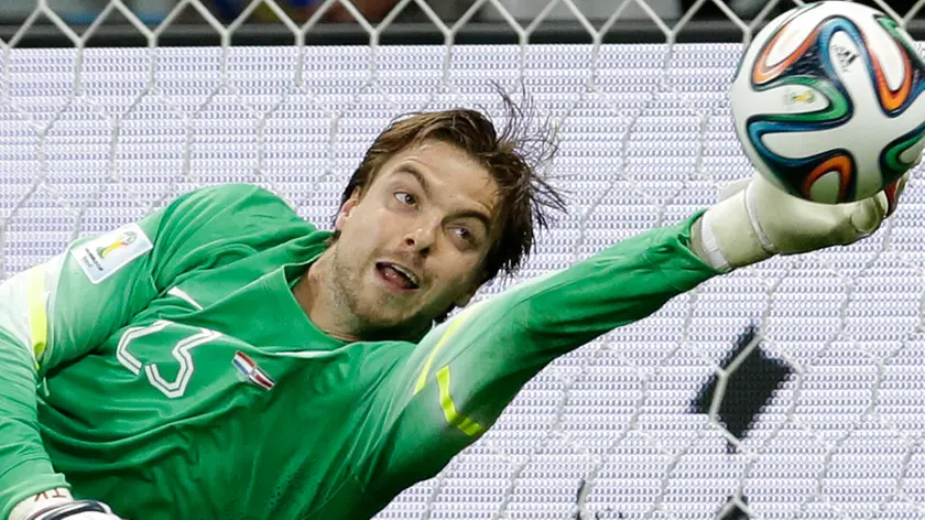 ALTERNATIVE CROP OF WCEM302.- Netherlands' goalkeeper Tim Krul saves the last penalty kick during the World Cup quarterfinal soccer match between the Netherlands and Costa Rica at the Arena Fonte Nova in Salvador, Brazil, Saturday, July 5, 2014. The Ntherlands won 4-3 on penalty kicks. Late substitute Krul made two saves in a 4-3 penalty shootout victory over Costa Rica on Saturday to give the Netherlands a spot in the World Cup semifinals following a 0-0 draw.(AP Photo/Hassan Ammar)