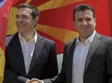 epa06815071 Greek Prime Minister Alexis Tsipras (L) and FYROM Prime Minister Zoran Zaev (R) shake hands after their arrival on Macedonian side of the Lake Prespa, near Otesevo, the Former Yugoslav Republic of Macedonia (FYROM), 17 June 2018. Prime Ministers from Greece and Macedonia meet in the Prespes lake district, that borders both countries, and sign an agreement aimed at ending a decades-long dispute between their countries. The agreement shall lead to the renaming of Greece's northern neighbour, as well as its EU and NATO entry. EPA/NAKE BATEV