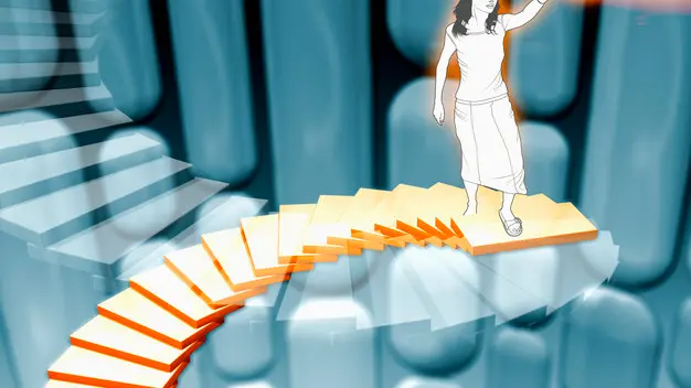 Woman standing on top of spiral staircase