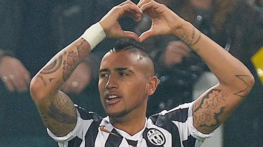 Juventus midfielder Arturo Vidal exults after scoring the goal of 1-0 in an UEFA Europa League round of 16 first leg match between Juventus and Fiorentina, Turin, 13 March 2014. ANSA / ALESSANDRO DI MARCO