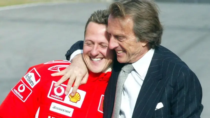 Il presidente della Ferrari Luca Cordero di Montezemolo abbraccia Michael Schumacher dopo la prova del la nuova 248 F1 che il prossimo anno correra' il Mondiale di Formula 1. ANSA/MARCO BUCCO