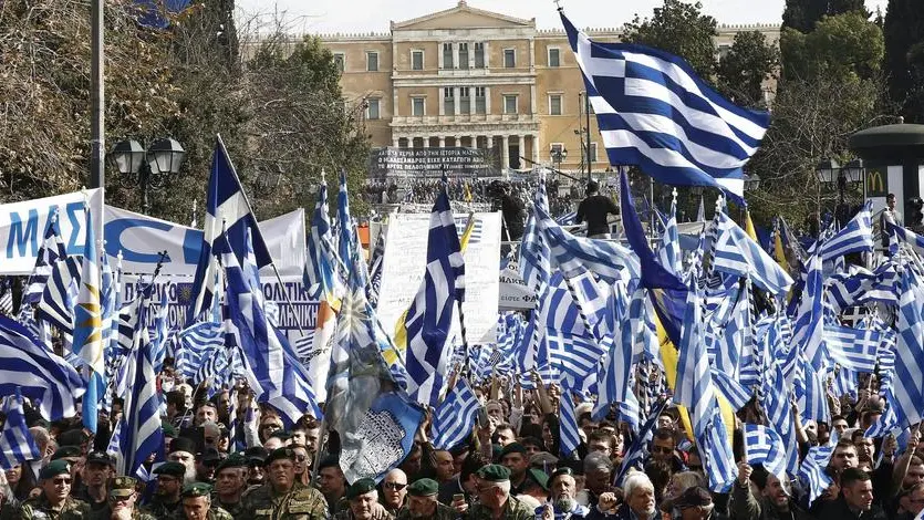 epa06496070 Protesters hold Greek flags and shout slogans during a massive rally over the name of the Former Yugoslav Republic of Macedonia (FYROM) against to its use of the name 'Macedonia' amid a revival of efforts to find a solution between the two countries, in Athens, Greece, 04 February 2018. EPA/ALEXANDROS VLACHOS