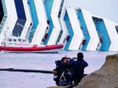 Cruise ship Costa Concordia lies stricken off the shore of the island of Giglio on January 18, 2012 in Giglio Porto, Italy. ANSA/MASSIMO PERCOSSI