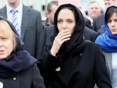 epa04144708 US actress Angelina Jolie (C) and British Foreign Secretary William Hague (not pictured) visit Potocari Memorial Center during her visit to the Memorial Center of Potocari, near Srebrenica, Bosnia and Hercegovina, 28 March 2014. Bosnian Serb troops killed up to 8,000 Bosnian Muslim men 19 years ago, after they captured the former eastern Bosnian Muslim enclave of Srebrenica, during the 1992-1995 war in Bosnia-Herzegovina. EPA/FEHIM DEMIR