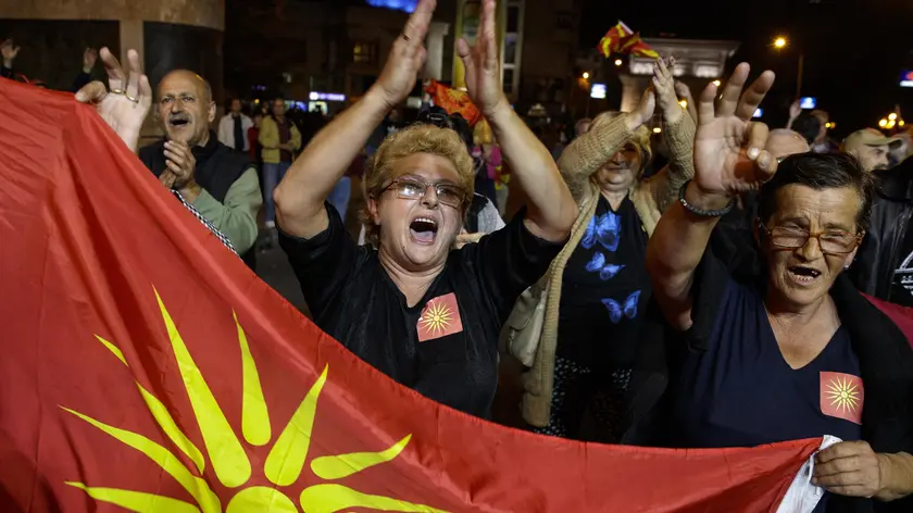 epa07060008 The opponents of the referendum celebrate the small response of the voters on the referendum on the country's name change in front of the Parliament building in Skopje, The Former Yugoslav Republic of Macedonia, 30 September 2018. The latest information from the State Election Commission suggests that about 35 percent (623,000) from Almost two million citizens of Macedonia came out to vote, while a successful referendum required 50 percent of votes plus one. EPA/VALDRIN XHEMAJ