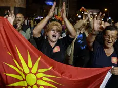 epa07060008 The opponents of the referendum celebrate the small response of the voters on the referendum on the country's name change in front of the Parliament building in Skopje, The Former Yugoslav Republic of Macedonia, 30 September 2018. The latest information from the State Election Commission suggests that about 35 percent (623,000) from Almost two million citizens of Macedonia came out to vote, while a successful referendum required 50 percent of votes plus one. EPA/VALDRIN XHEMAJ