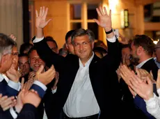 epa08529819 Croatian Prime Minister and leader of Croatian Democratic Union (HDZ) Andrej Plenkovic celebrates victory of the Parliamentary elections in downtown Zagreb, Croatia, 05 July 2020. Croatian people voted in Parliamentary elections to elect new authorities for next four years. EPA/ANTONIO BAT