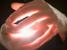 Man Holding Crystal Ball --- Image by © Tom Grill/Corbis