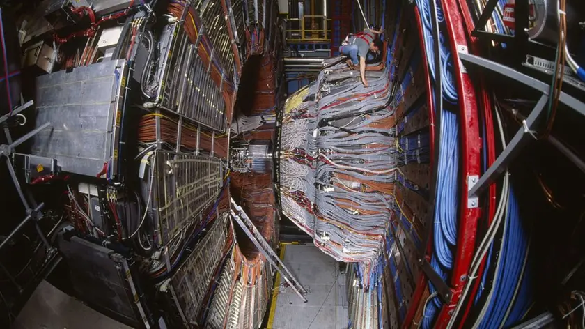 01 Jun 1994, Geneva, Switzerland --- The Large Electron-Positron Collider (LEP) ring in the detector Delphi, one of the four experiments in the particle accelerator. Founded in 1954, the European Organization for Nuclear Research (CERN) is the "European laboratory for particle physics", one of Europe's first joint ventures, which includes 19 member states. CERN is the world's largest particle physics center, where scientists unite to study the building blocks of matter and the forces that hold them together. To be able to see and study particles which are extremely tiny, scientists use special tools as accelerators, accelerating particles to almost the speed of light, and detectors to make the particles visible. | Location: Near Geneva, Switzerland. --- Image by © Frederic Pitchal/Sygma/Corbis