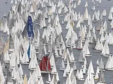 Un'immagine della partenza della 44/a edizione della regata Barcolana nello specchio di mare prospiciente il Faro della Vittoria, 14 ottobre 2012 a Trieste. .More than 1,700 yachts convene in the Gulf of Trieste (northern Italy) fort the 44/th edition of the Barcolana Sail Race, 14 October 2012. The spectacular annual race is the largest sailing event in Europe and the only regatta in the world to set a single start line for so many yachts. .ANSA/ANDREA LASORTE