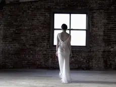 Ghostly Bride in attic --- Image by © Elisa Lazo de Valdez/Corbis