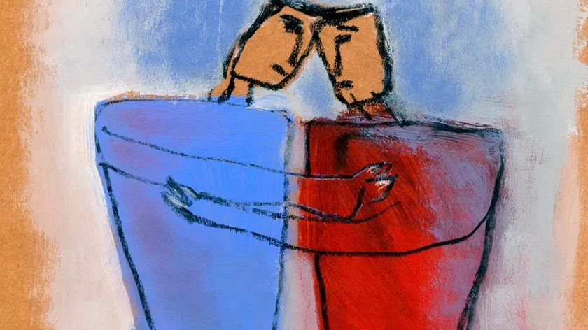 Two men hugging each other --- Image by © Marie Bertrand/Corbis