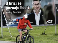 epa08513854 A man passes near by huge election posters with picture of Croatian Prime Minister Andrej Plenkovic of Croatian Democratic Union (HDZ) in downtown Zagreb, Croatia, 28 June 2020. Croatia will elect on 05 July new Parliament and Government. EPA/ANTONIO BAT