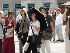 Turisti a passeggio per Trieste