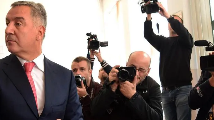 epa05587692 Montenegrin Prime Minister Milo Djukanovic casts his ballot during Montenegro's parliamentary elections in Podgorica, 16 October 2016. The vote could possibly end the 27-year long ruling of Montenegro's ruling Democratic Party of Socialists (DPS) party. The election campaign in the ex-Yugoslav country focused on joining the European Union and NATO. EPA/BORIS PEJOVIC CAPTION CORRECTION: