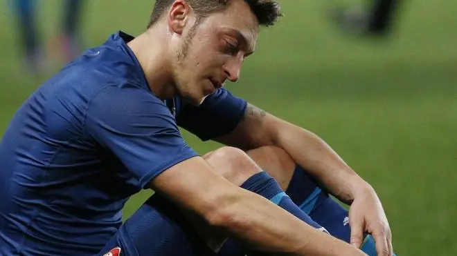 epa04666738 Mesut Ozil of Arsenal reacts after UEFA Champions League round of 16 second leg soccer match between AS Monaco and Arsenal FC at Louis II Stadium, in Monaco, 17 March 2015. Monaco sneaked into the quarter-finals of the UEFA Champions League despite losing 2-0 at home to Arsenal. EPA/YOAN VALAT